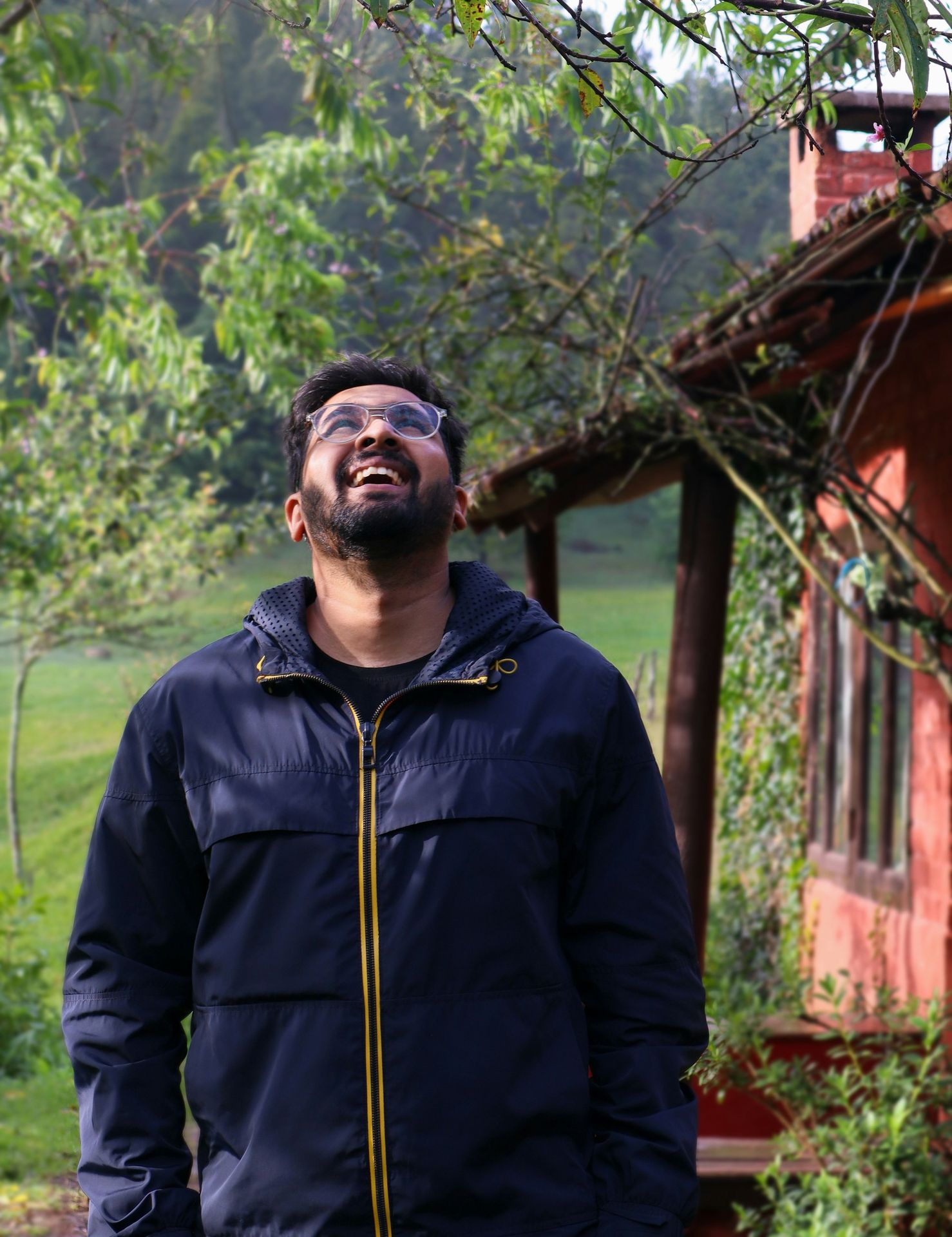 a man standing in front of a house